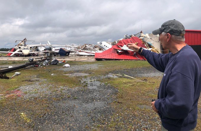 Congressman Ralph Abraham surveys the damage at the Monroe Airport